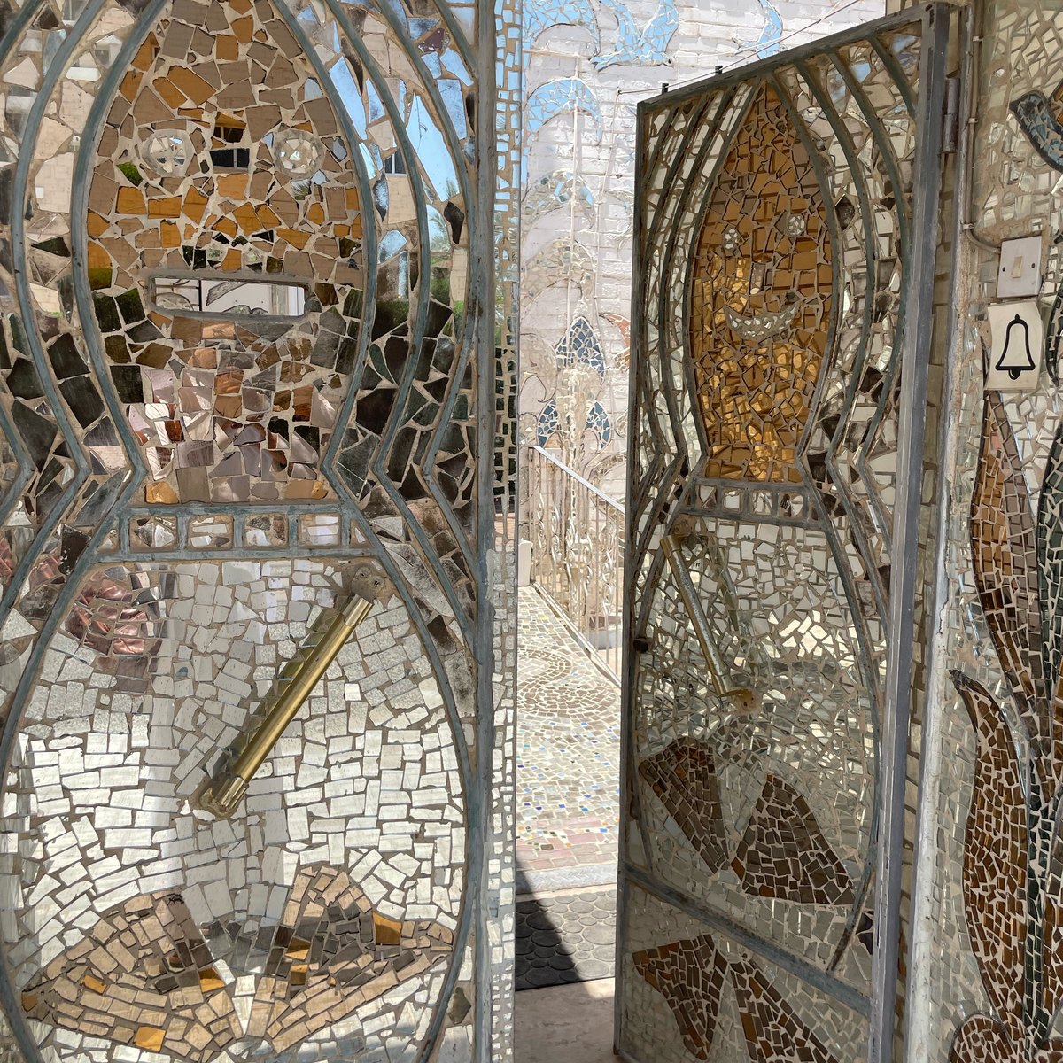 The ornate mirror-mosaic gate seen from inside the threshold